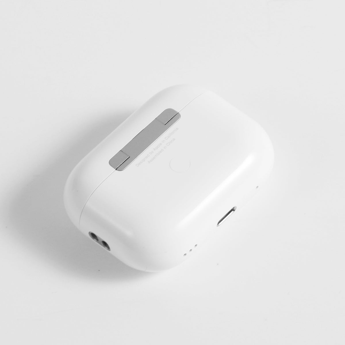 Detail view of white AirPods Pro charging case